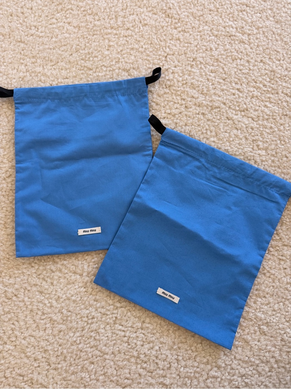 2 small Miu Miu pouch